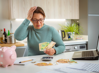 concerned lady counting money for bills